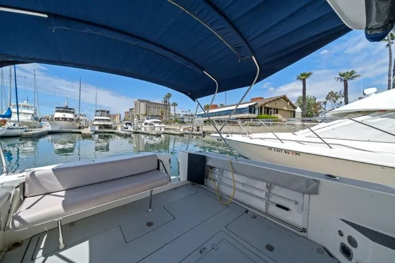 Slide: The Image of 2007 Albin 28 Tournament Express boat docked in a marina under blue canopy. - 7