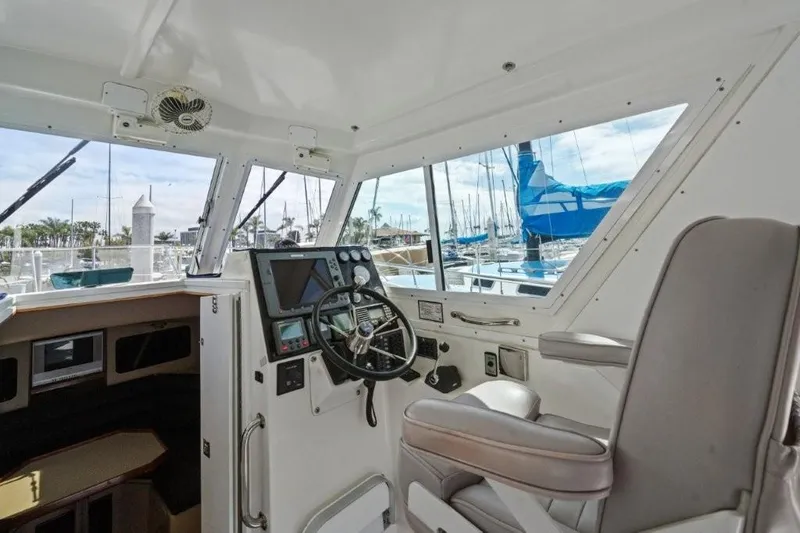 Slide: The Image of 2007 Albin 28 Tournament Express helm with steering wheel and navigation equipment. - 9