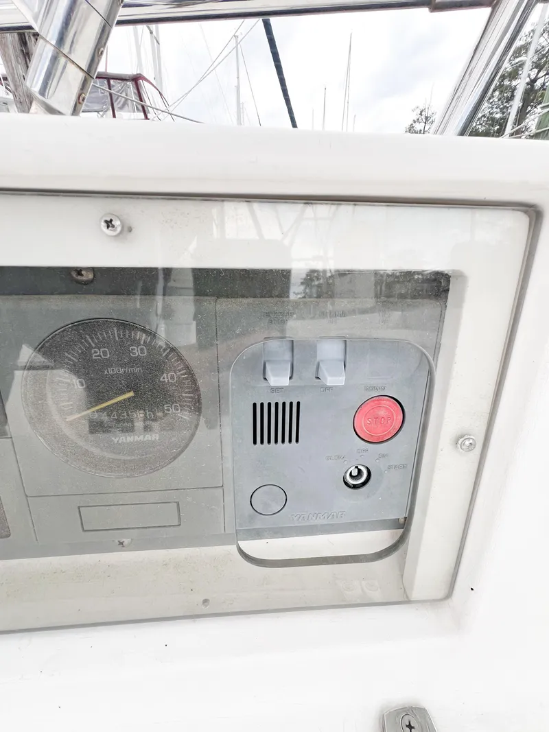 Slide: The Image of Control panel of a 1998 Saga 43 boat with gauges and buttons. - 16