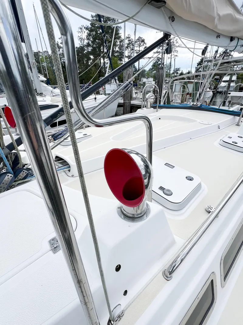 Slide: The Image of Sailboat deck of 1998 Saga 43 with red vent and stainless steel railings. - 21