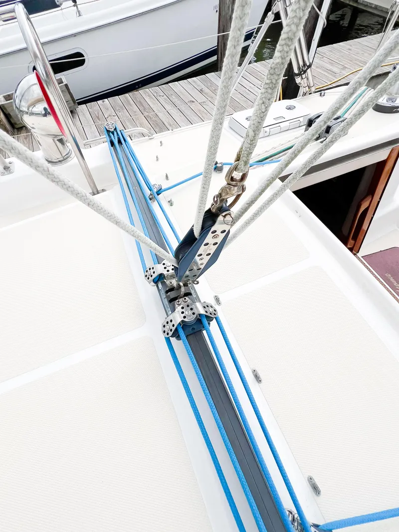 Slide: The Image of Sailboat deck with rigging, Saga 43 model, 1998, docked at marina. - 23