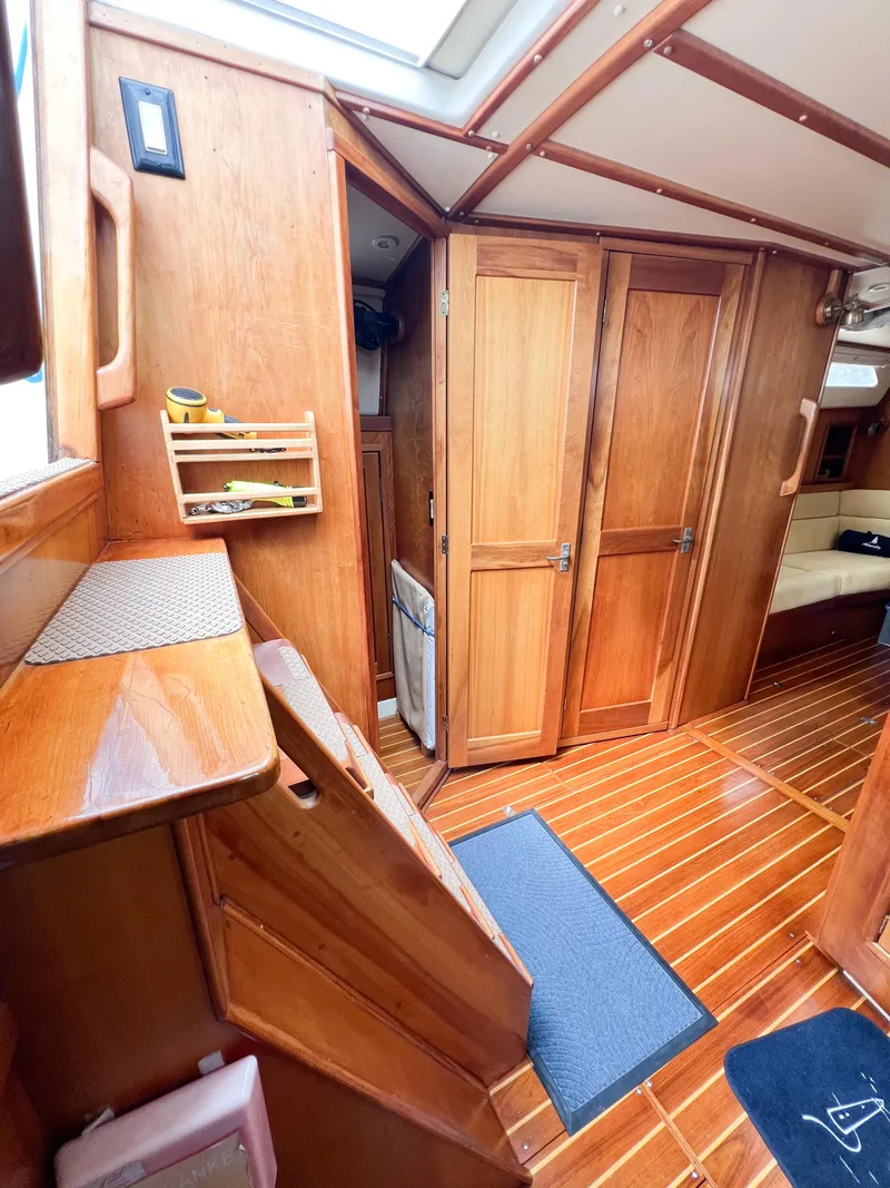 Slide: The Image of Interior of 1998 Saga 43 sailboat with wooden cabinetry and flooring. - 34