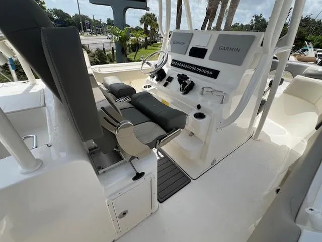 Slide: The Image of 2025 Key West 263 FS boat interior with Garmin navigation system and seating. - 10