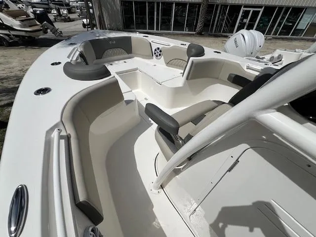 Slide: The Image of 2025 Key West 263 FS boat interior with seating and console, showcasing modern design. - 12