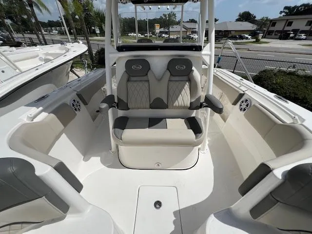 Slide: The Image of 2025 Key West 263 FS boat interior with cushioned seating and modern design. - 14