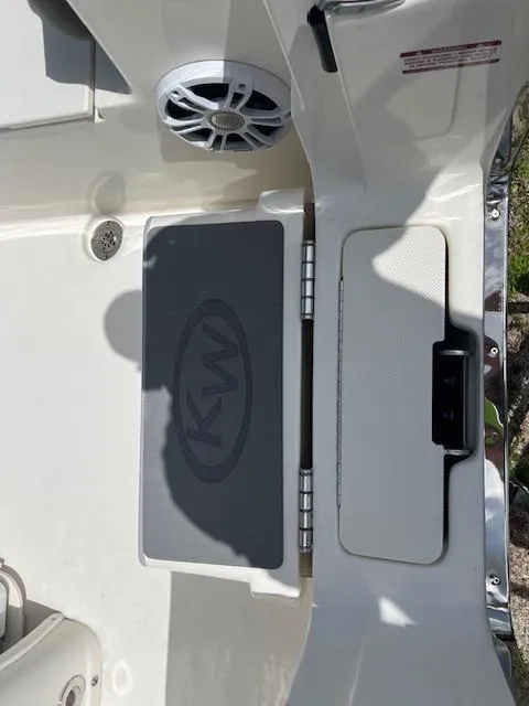 Slide: The Image of 2025 Key West 263 FS boat deck with KW logo and speaker. - 3