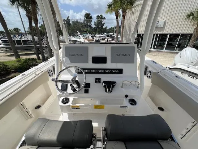 Slide: The Image of 2025 Key West 263 FS boat cockpit with Garmin displays and dual seating. - 6