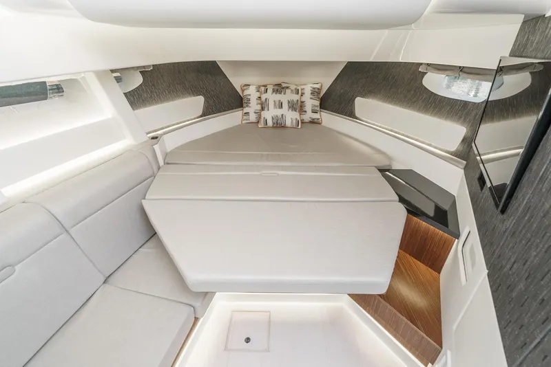 Slide: The Image of 2023 Sea Ray Sundancer 370 OB cabin interior with modern seating and stylish decor. - 29