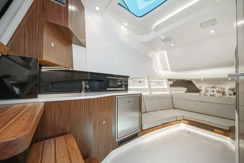 Slide: The Image of Luxurious interior of 2023 Sea Ray Sundancer 370 OB with modern kitchen and seating area. - 33