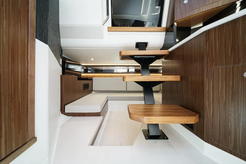 Slide: The Image of 2023 Sea Ray Sundancer 370 OB interior with modern wood finishes and sleek design. - 34