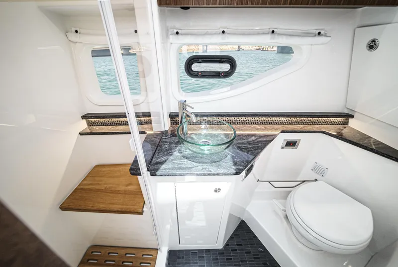 Slide: The Image of Luxurious bathroom in 2023 Sea Ray Sundancer 370 OB yacht with modern fixtures and ocean view. - 38