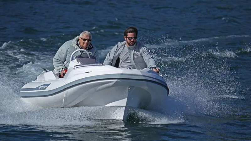 Slide: The Image of Two people riding a 2020 Zar Formenti ZF-1 boat on the water. - 14