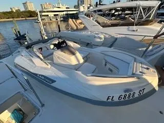 Slide: The Image of 2020 Zar Formenti ZF-1 boat docked at marina, sunny day, cityscape background. - 2