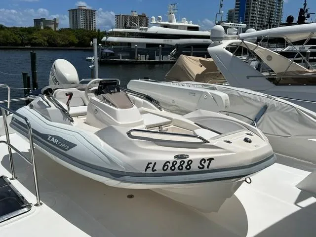 Slide: The Image of 2020 Zar Formenti ZF-1 boat docked at marina with city skyline background. - 9