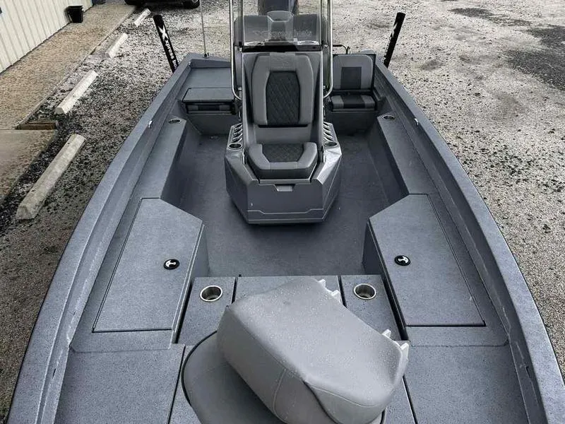 Slide: The Image of 2025 Xpress H22 Bay boat interior with seating and storage compartments. - 10