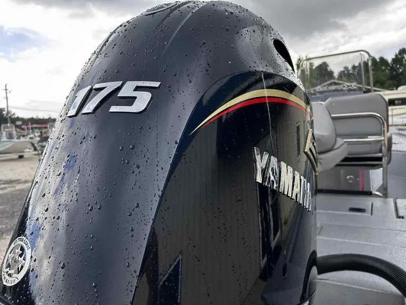 Slide: The Image of Yamaha 175 outboard motor on 2025 Xpress H22 Bay boat, wet with raindrops. - 16