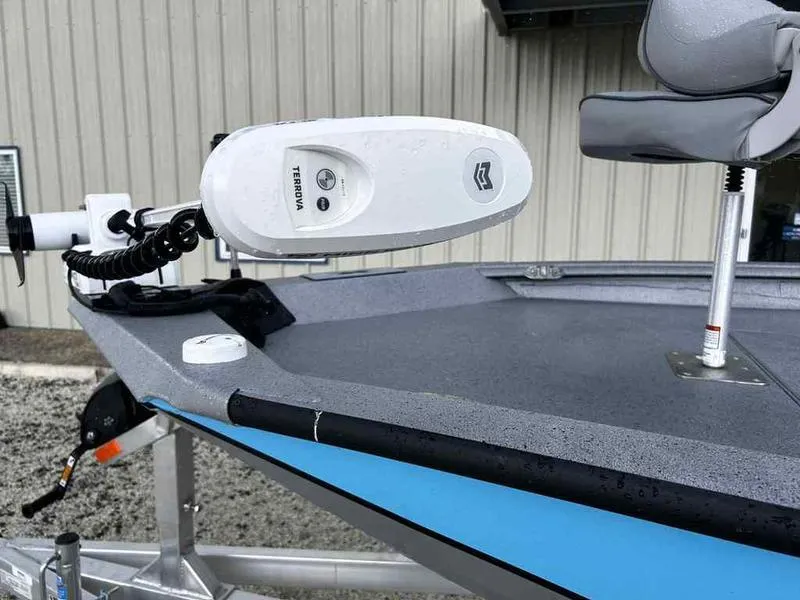 Slide: The Image of 2025 Xpress H22 Bay boat with trolling motor and seating, parked outdoors. - 7