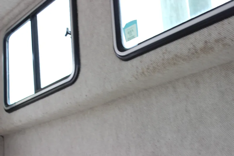 Slide: The Image of Interior view of a 2014 Parker 2530 Extended Cabin boat window. - 24