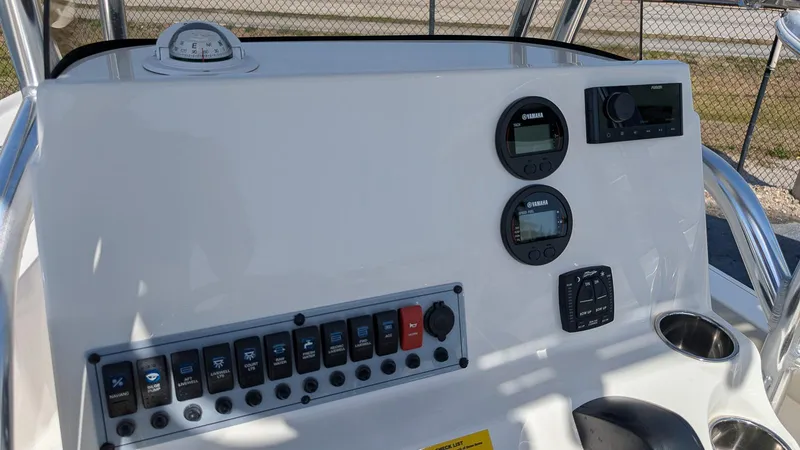 Slide: The Image of Control panel of 2025 Key West 210 Bay Reef boat with gauges and switches. - 15