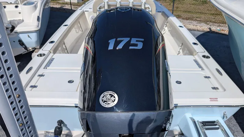 Slide: The Image of 2025 Key West 210 Bay Reef boat with 175 horsepower engine, rear view. - 6