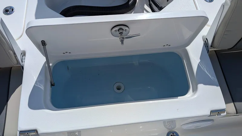 Slide: The Image of Open storage compartment on 2025 Key West 210 Bay Reef boat. - 9