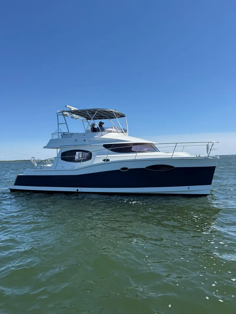 The Image of 2012 Fountaine Pajot 40 catamaran on calm water under clear blue sky. - 0