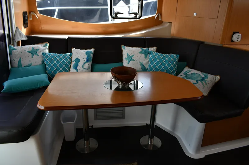 Slide: The Image of Interior of 2012 Fountaine Pajot 40 catamaran with cozy seating and decorative pillows. - 10
