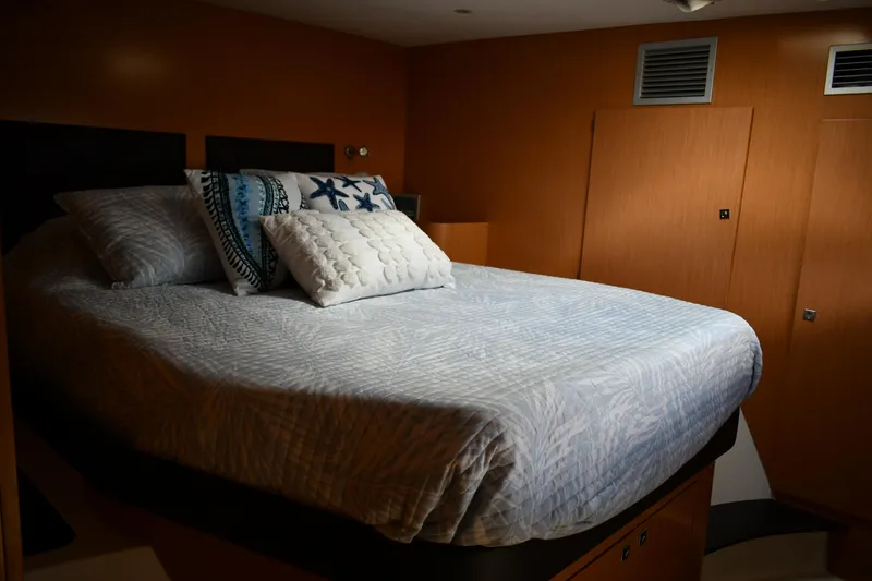 Slide: The Image of Cozy bedroom interior of 2012 Fountaine Pajot 40 yacht with stylish bedding and pillows. - 13