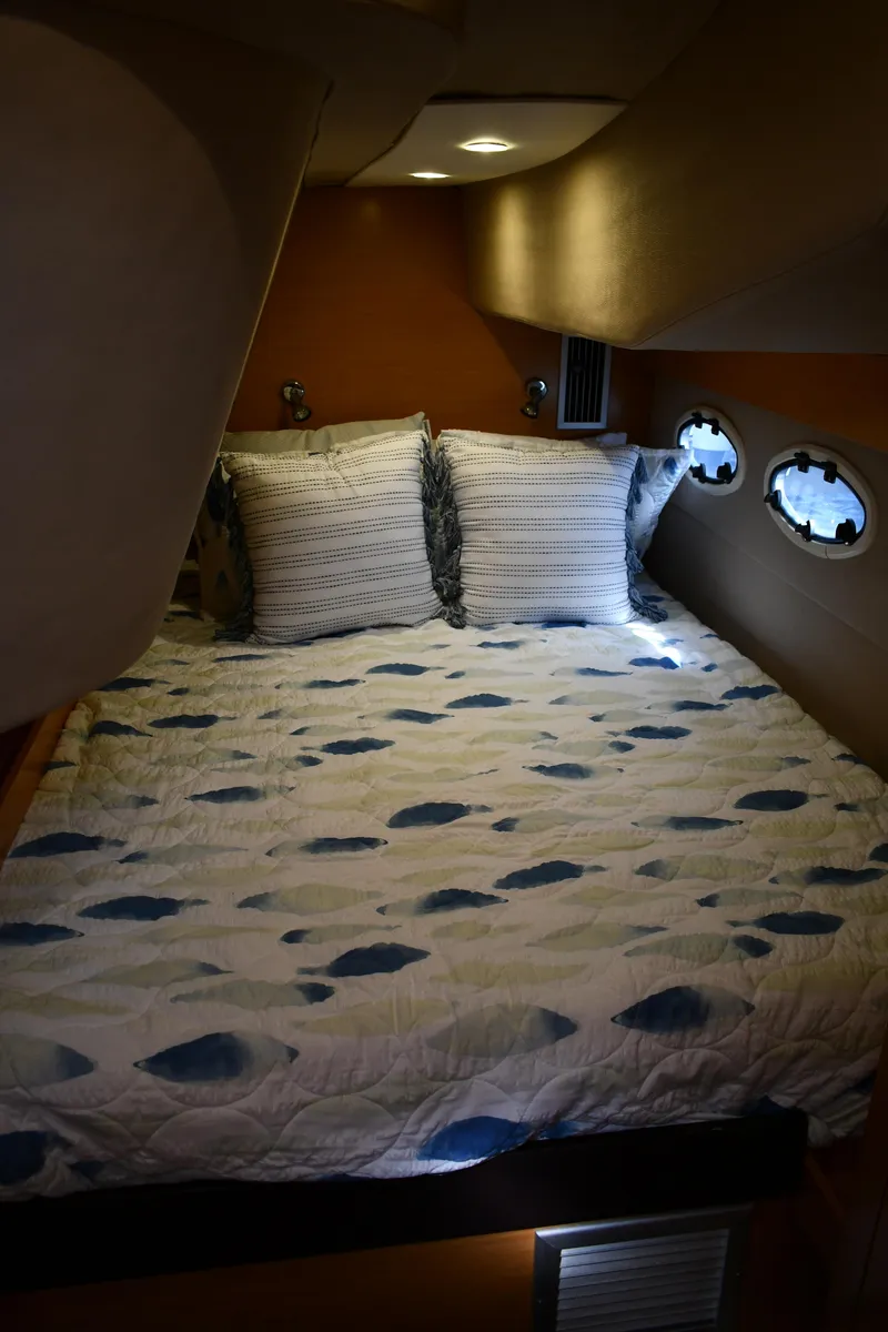 Slide: The Image of Cozy cabin interior of 2012 Fountaine Pajot 40 with patterned bedding and porthole windows. - 17