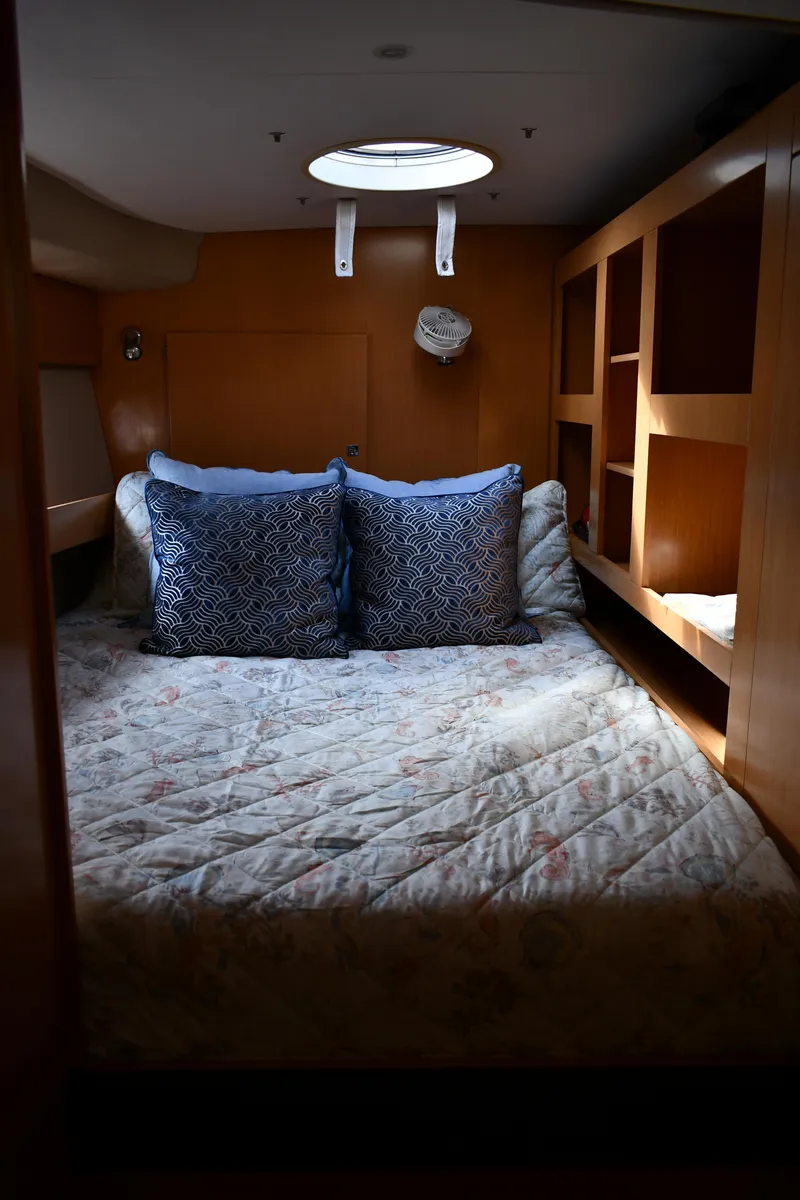 Slide: The Image of Cozy cabin interior of 2012 Fountaine Pajot 40 catamaran with bed and storage shelves. - 18