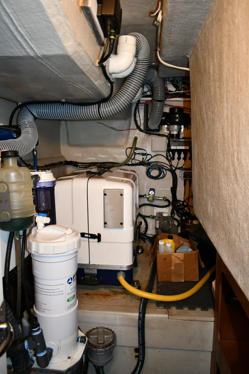 Slide: The Image of Engine room of a 2012 Fountaine Pajot 40 catamaran with various mechanical components. - 22