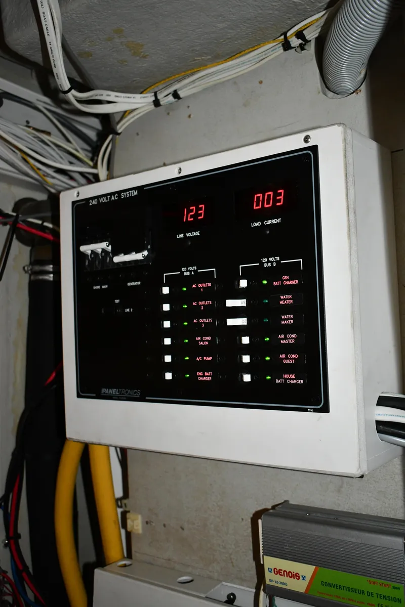Slide: The Image of Electrical panel on a 2012 Fountaine Pajot 40 catamaran, displaying voltage and current readings. - 23