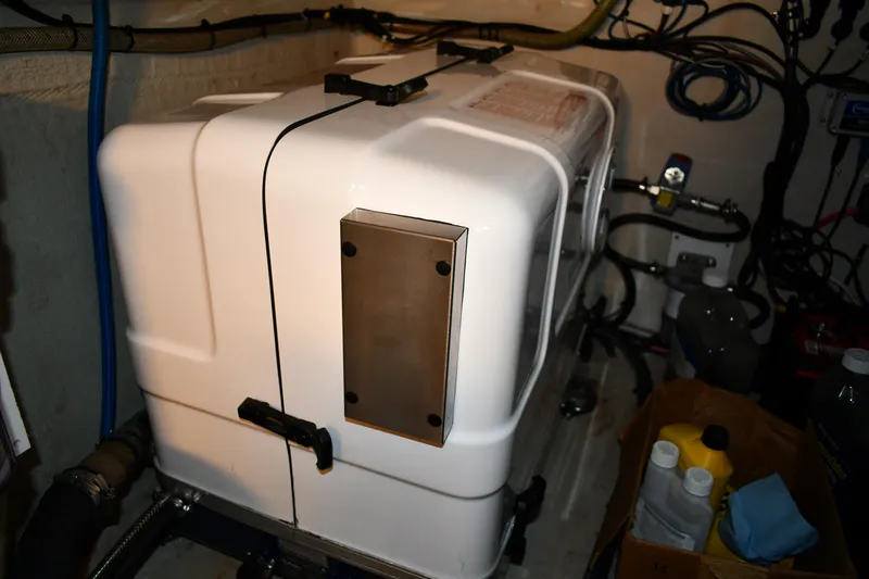 Slide: The Image of Engine compartment of 2012 Fountaine Pajot 40 catamaran, featuring machinery and maintenance supplies. - 24