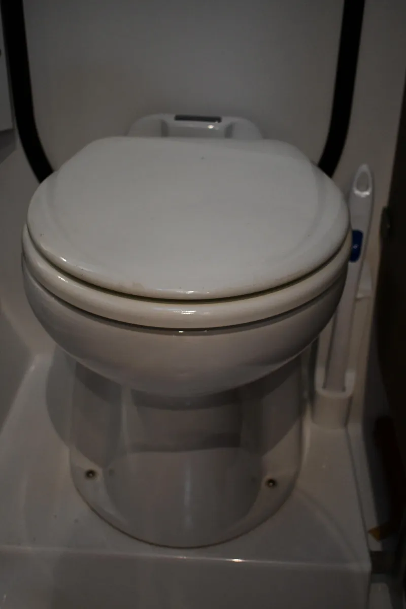 Slide: The Image of Toilet in 2012 Fountaine Pajot 40 catamaran bathroom, featuring compact marine design. - 28