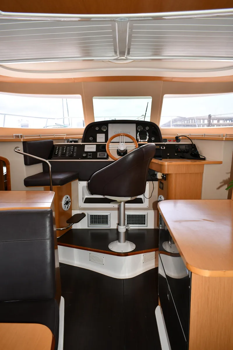Slide: The Image of Interior of 2012 Fountaine Pajot 40 yacht, featuring helm station and seating area. - 36