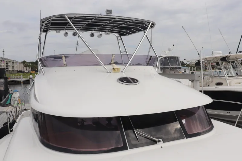 Slide: The Image of 2012 Fountaine Pajot 40 catamaran docked at marina, front view. - 5