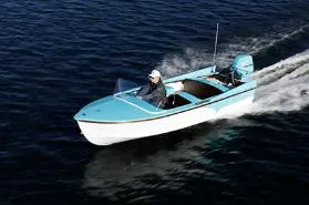 Slide: The Image of 2025 Starcraft 57 SKI CHAMP boat cruising on open water. - 10