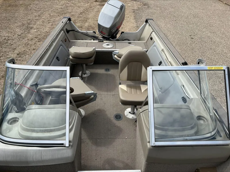 Slide: The Image of 1998 Tracker Targa 185 WT boat interior with seating and steering wheel. - 11