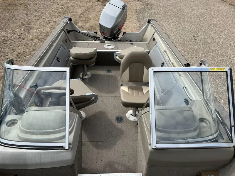 Slide: The Image of 1998 Tracker Targa 185 WT boat interior with seating and steering wheel. - 5