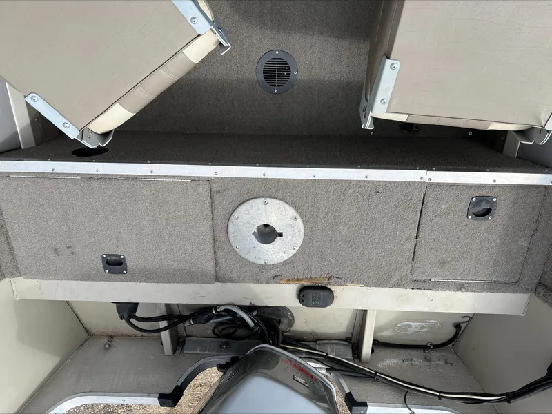 Slide: The Image of 1998 Tracker Targa 185 WT boat interior with storage compartments and seating. - 6