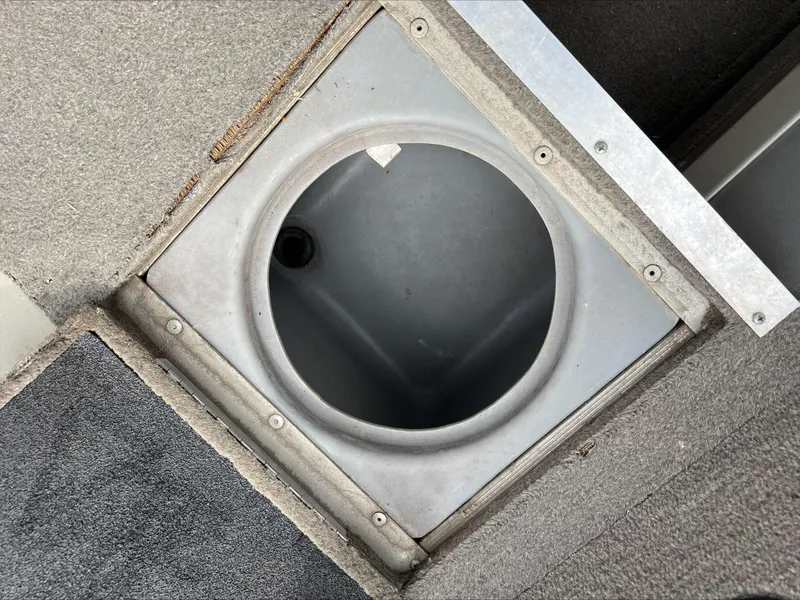 Slide: The Image of 1998 Tracker Targa 185 WT boat storage compartment, circular and built-in. - 8