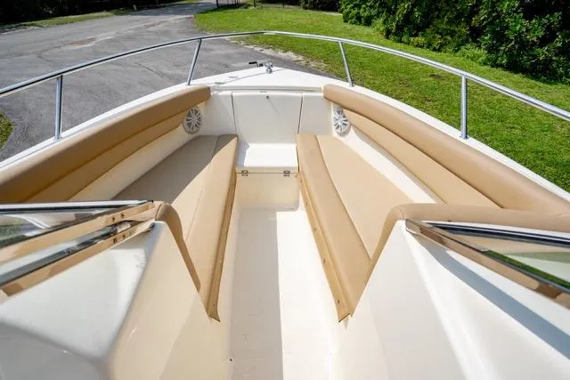 Slide: The Image of 2021 Scout 210 Dorado boat interior with tan seating and stainless steel railings. - 8
