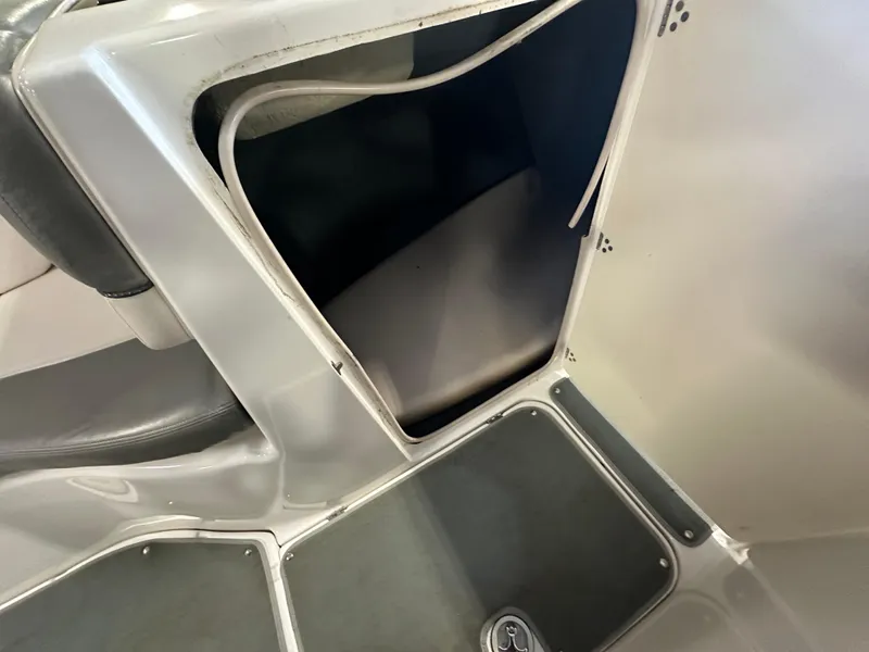 Slide: The Image of 2009 Yamaha Boats SX210 storage compartment with open hatch, showcasing interior space. - 14