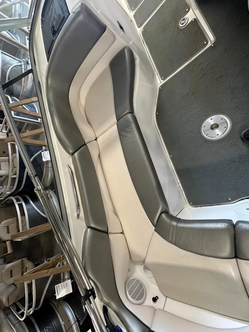 Slide: The Image of 2009 Yamaha Boats SX210 interior with gray and white seating. - 15