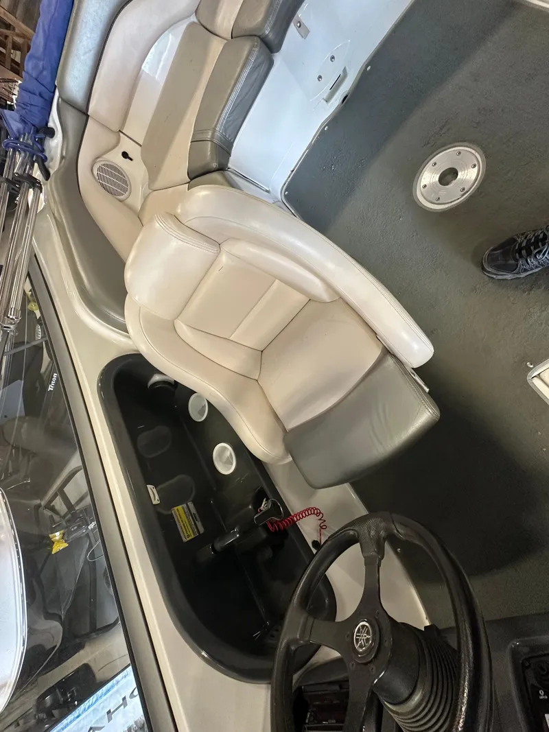 Slide: The Image of 2009 Yamaha SX210 boat interior with steering wheel and seating. - 18