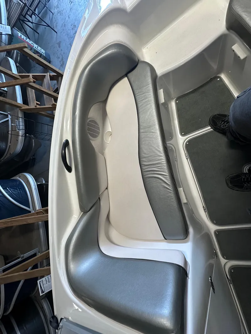 Slide: The Image of 2009 Yamaha SX210 boat interior with gray and white seating. - 20