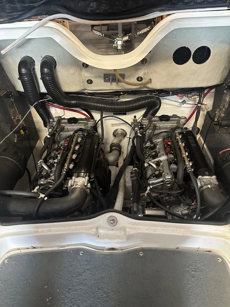 Slide: The Image of 2009 Yamaha Boats SX210 engine compartment with dual engines and visible wiring. - 21