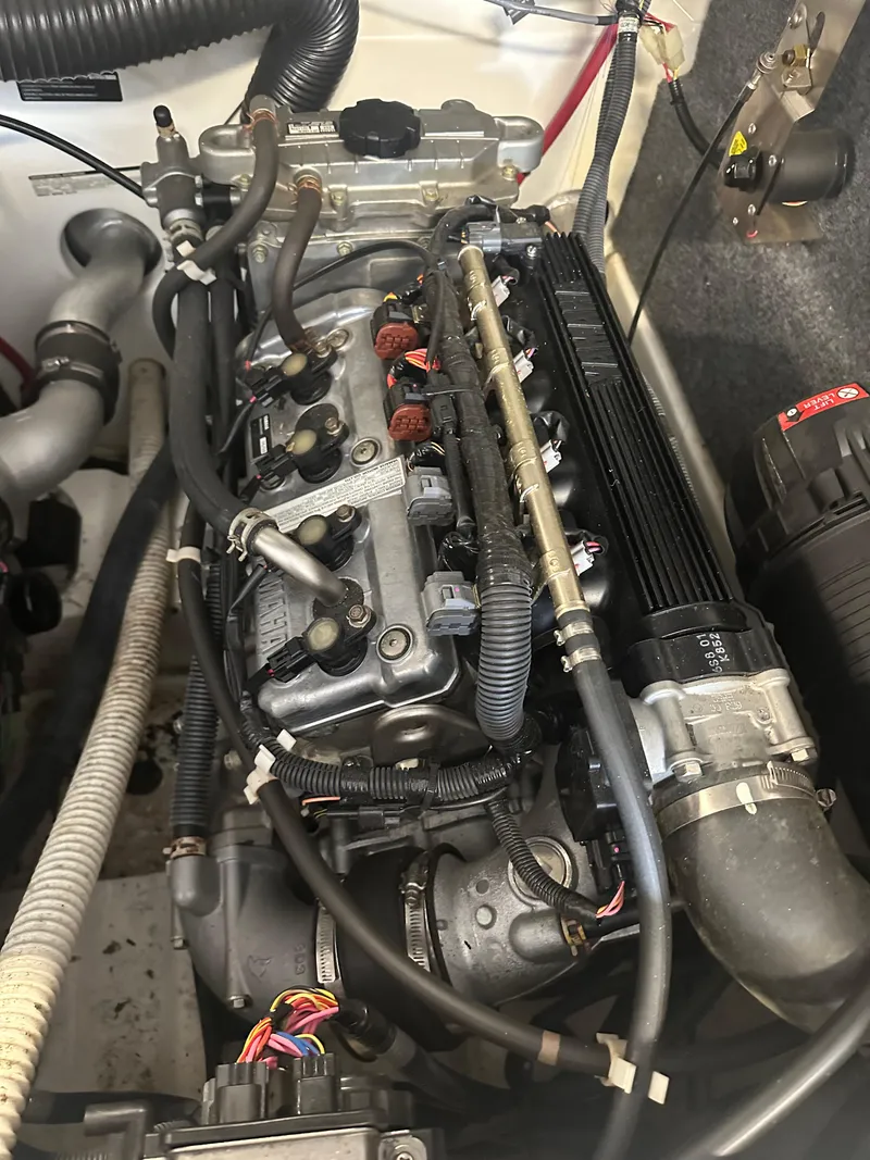 Slide: The Image of 2009 Yamaha Boats SX210 engine compartment with visible components and wiring. - 22