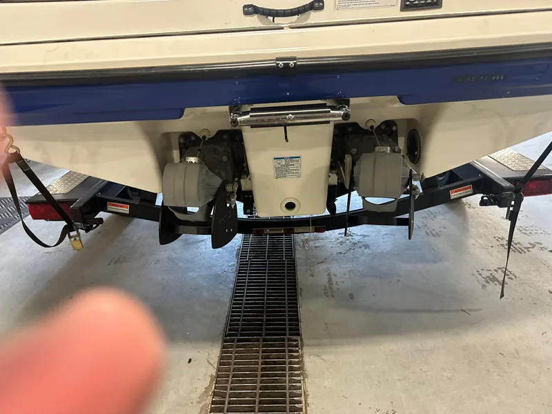 Slide: The Image of Rear view of a 2009 Yamaha Boats SX210 on a trailer in a garage. - 25