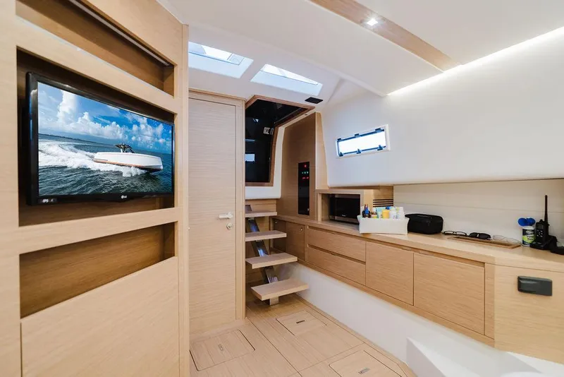 Slide: The Image of Interior of 2022 Pardo Yachts 43, featuring modern design and wooden finishes. - 2